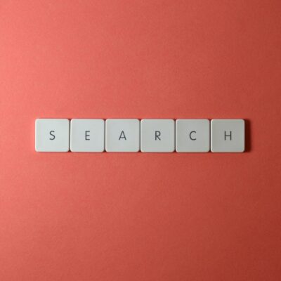 White keyboard keys spelling 'search' on a bold red surface, conceptual design with copyspace.